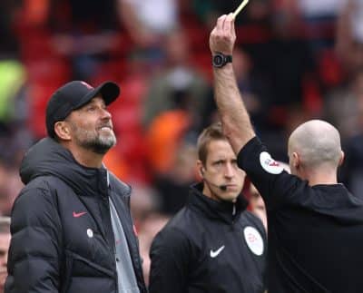 Jurgen Klopp Receives A Yellow Card During Liverpool'S Win Over Tottenham.