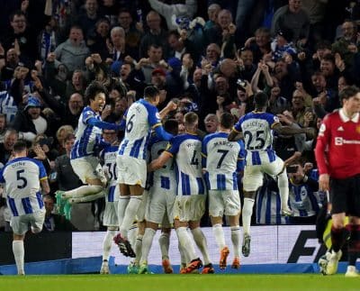 Brighton players celebrate their winning goal against Man Utd